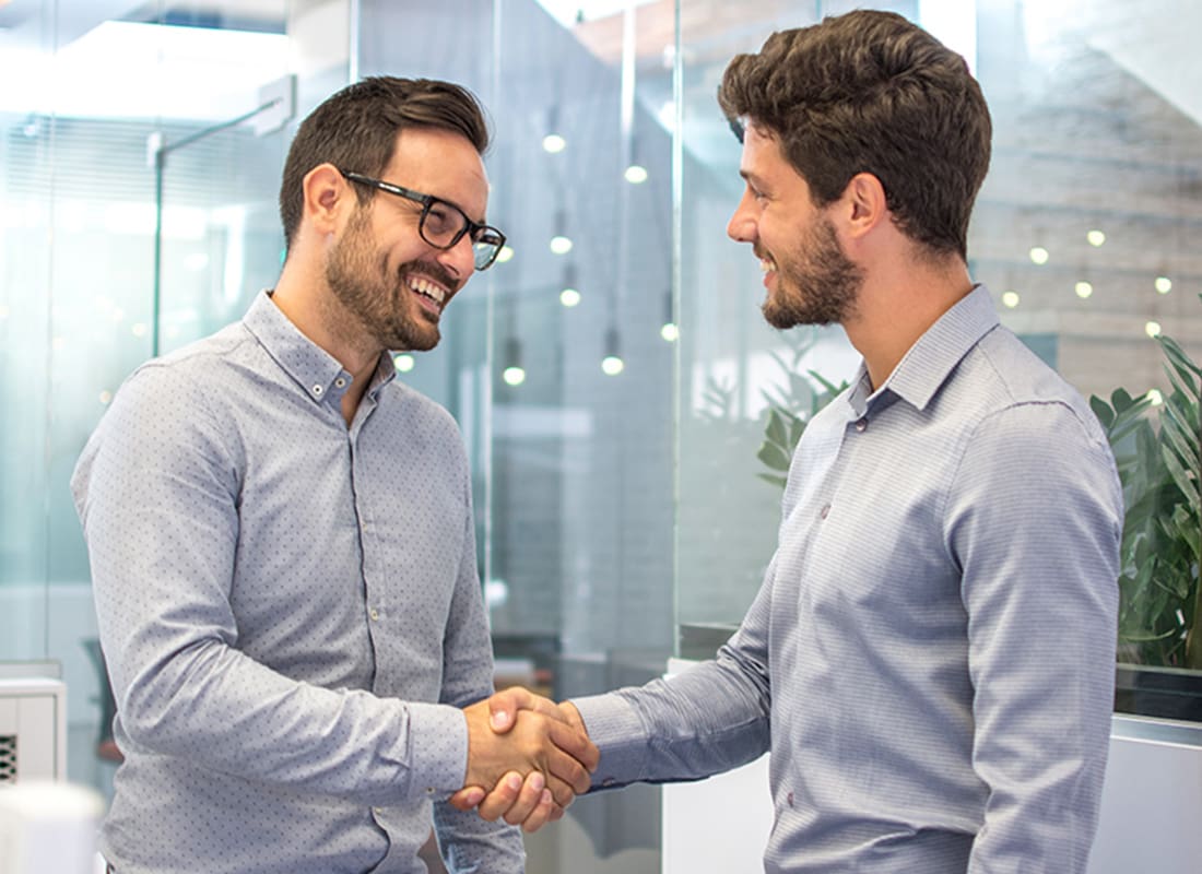 About Our Agency - Two Business People Shaking Hands